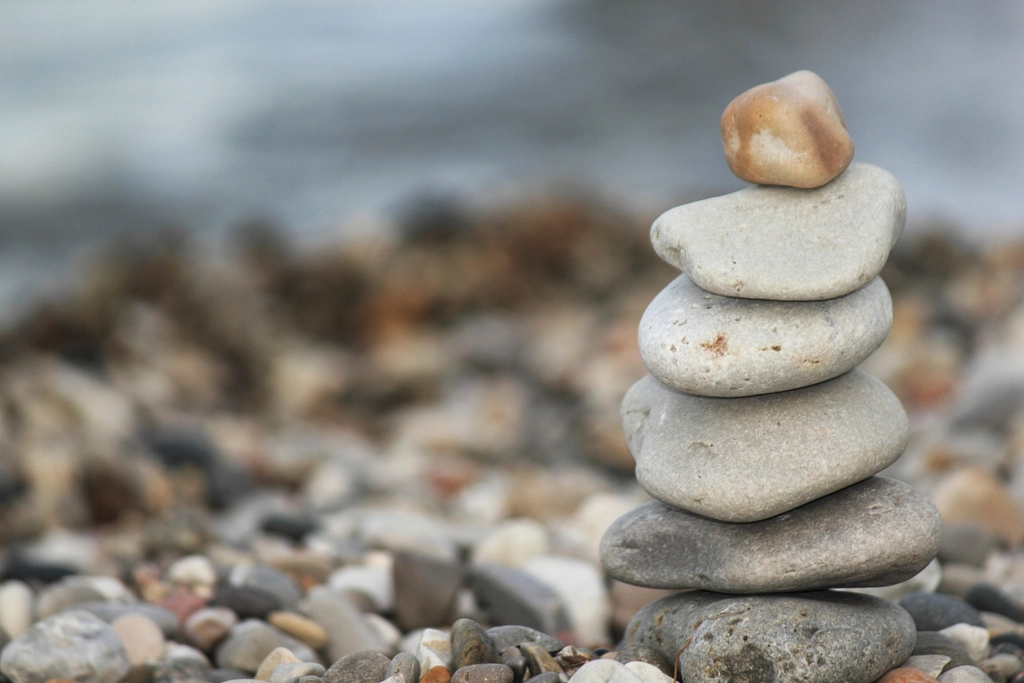 Balanced stacked stones representing wellness and calm